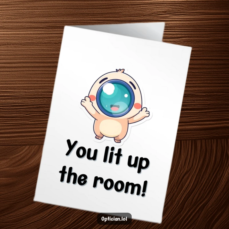 Free Printable Congratulations Card: Small, energetic creature proudly presents a bright, glowing lens, celebrating success.